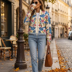 Cream floral zip cardigan with hand-drawn wildflowers, gold zipper and ribbed cuffs in a relaxed bomber fit