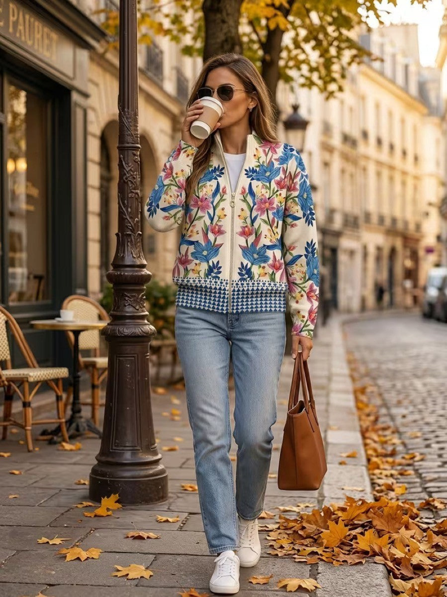Cream floral zip cardigan with hand-drawn wildflowers, gold zipper and ribbed cuffs in a relaxed bomber fit