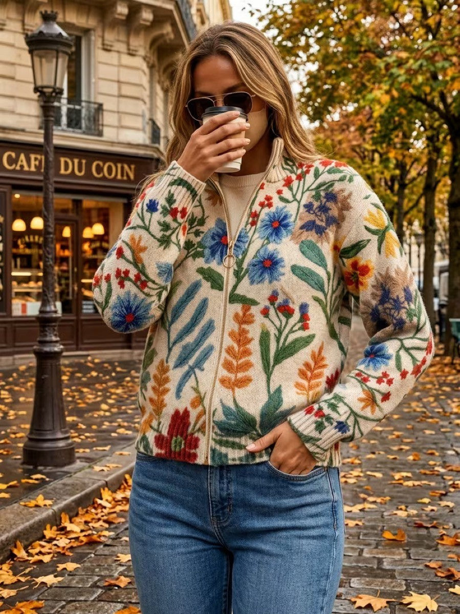 Cream floral zip cardigan with hand-drawn wildflowers, gold zipper and ribbed cuffs in a relaxed bomber fit