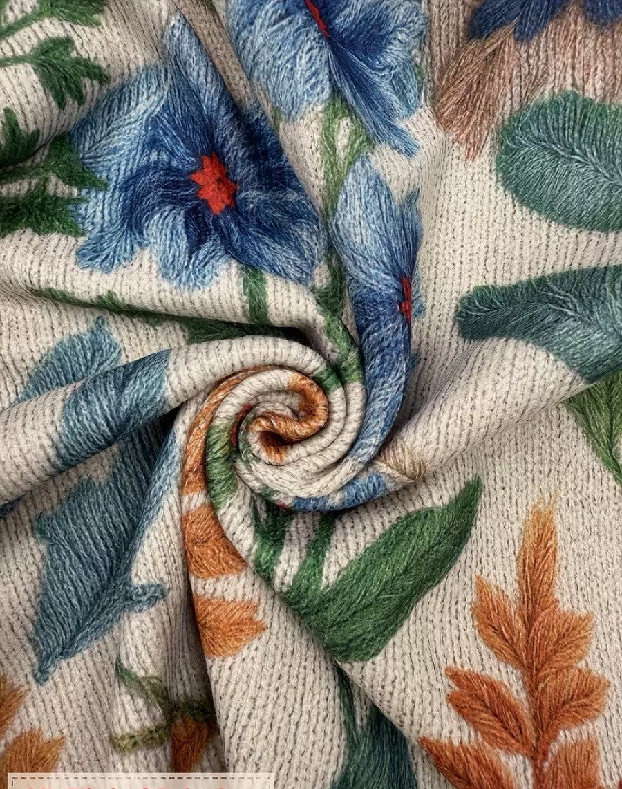 Cream floral zip cardigan with hand-drawn wildflowers, gold zipper and ribbed cuffs in a relaxed bomber fit