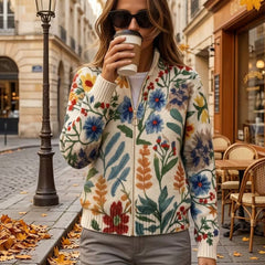 Cream floral zip cardigan with hand-drawn wildflowers, gold zipper and ribbed cuffs in a relaxed bomber fit