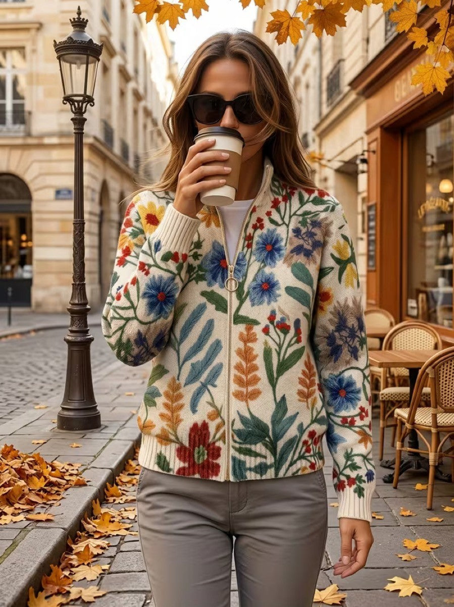 Cream floral zip cardigan with hand-drawn wildflowers, gold zipper and ribbed cuffs in a relaxed bomber fit