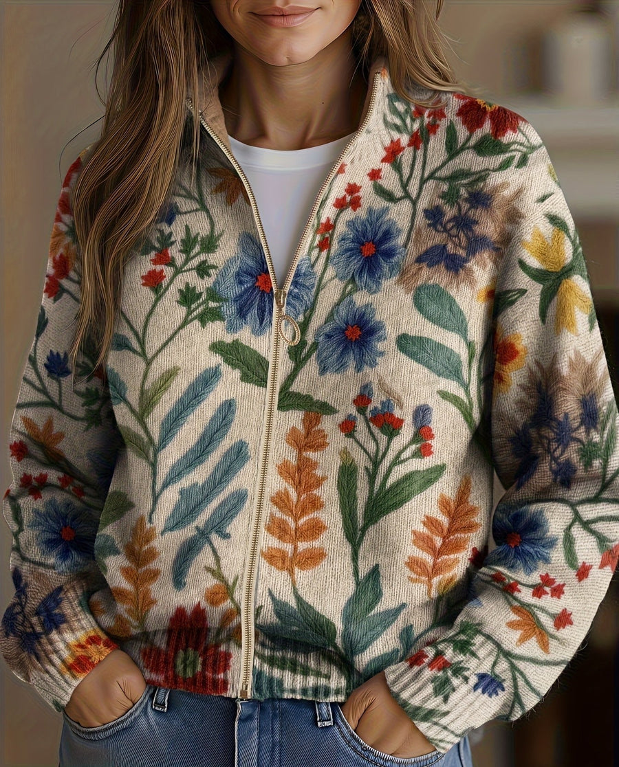 Cream floral zip cardigan with hand-drawn wildflowers, gold zipper and ribbed cuffs in a relaxed bomber fit