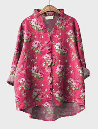 Pink ruffled floral blouse with soft drape and relaxed fit