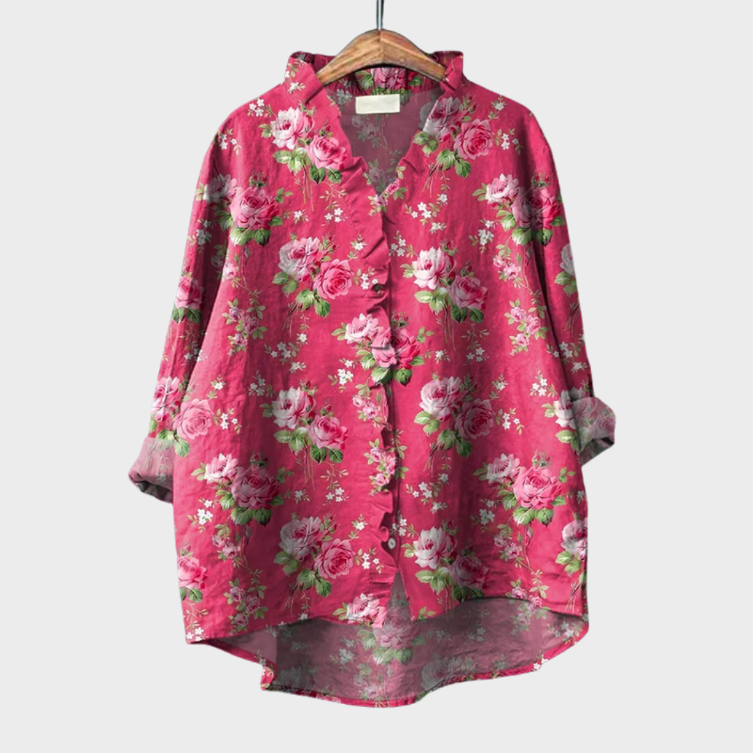 Pink ruffled floral blouse with soft drape and relaxed fit