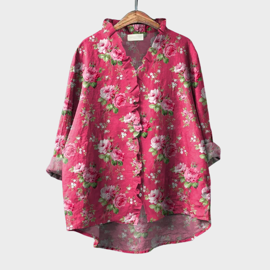 Pink ruffled floral blouse with soft drape and relaxed fit