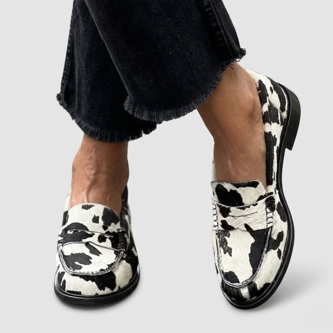 Zebra print slip-on loafers for women with a structured, elegant silhouette