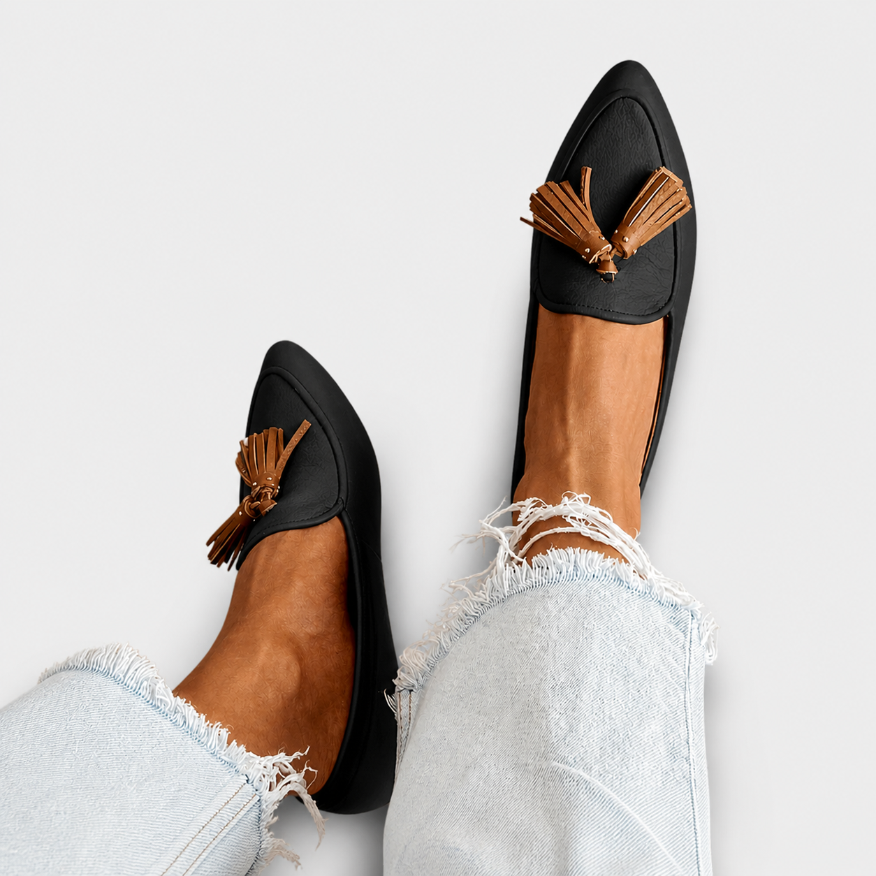 Modern fringed loafers for women with structured design and elegant detailing
