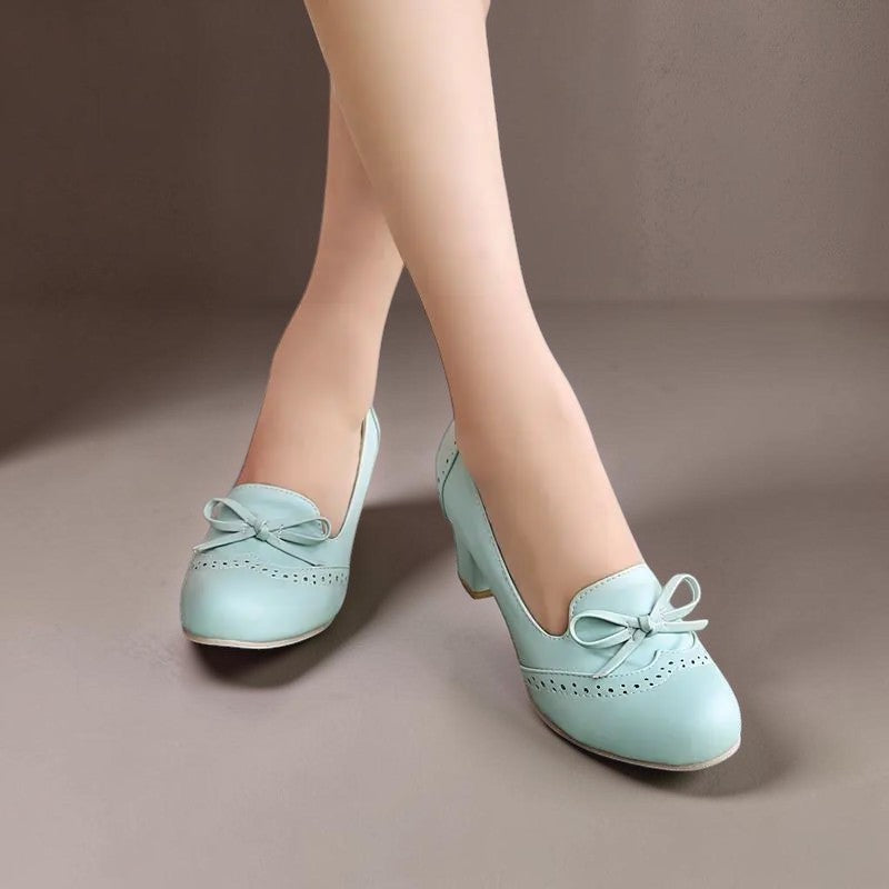 Adelaide closed-toe bow slip-on pumps on a low heel, shown in beige, pink and blue