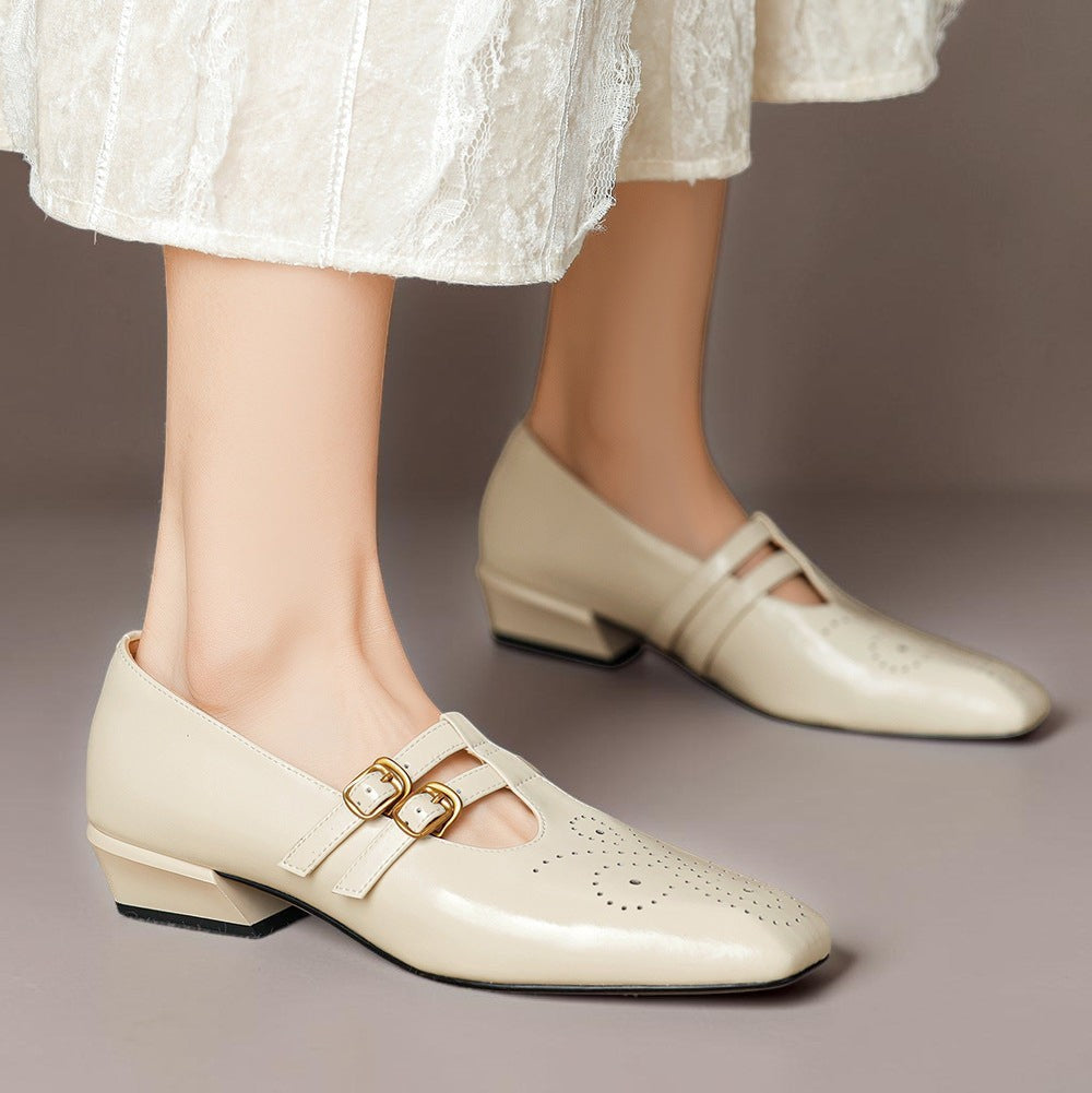 Brogued leather Mary Jane pump with dual buckled straps and a low block heel