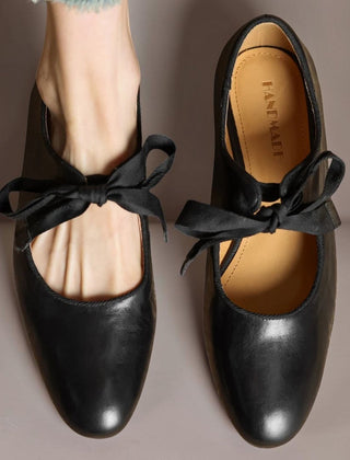 Leather bow Mary Jane flats with strap, shown in red, black and brown