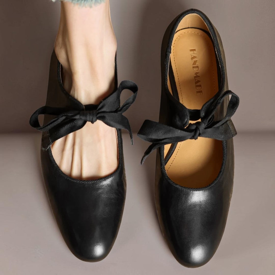 Leather bow Mary Jane flats with strap, shown in red, black and brown