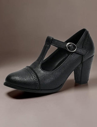 T-strap brogue heels with punched detailing on a steady block heel, shown in a neutral tone