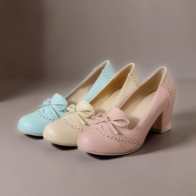 Adelaide closed-toe bow slip-on pumps on a low heel, shown in beige, pink and blue