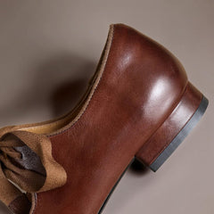 Leather bow Mary Jane flats with strap, shown in red, black and brown
