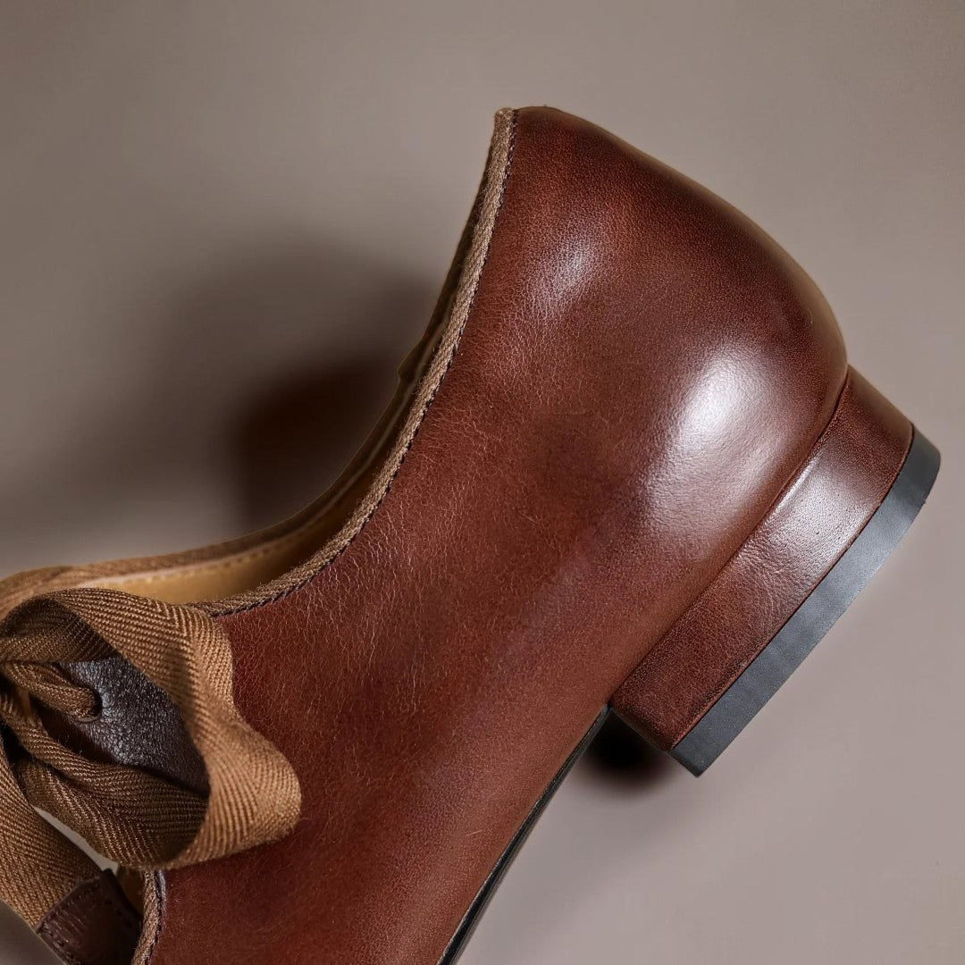 Leather bow Mary Jane flats with strap, shown in red, black and brown