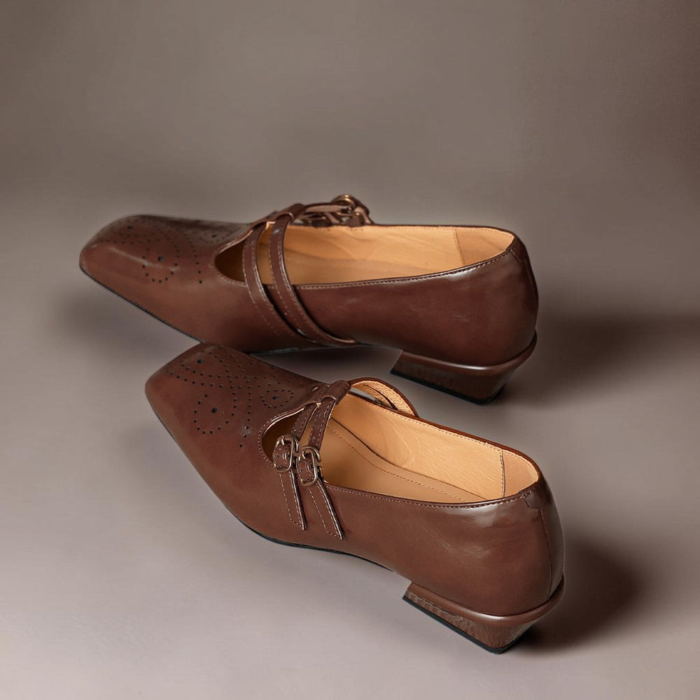 Brogued leather Mary Jane pump with dual buckled straps and a low block heel
