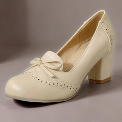 Adelaide closed-toe bow slip-on pumps on a low heel, shown in beige, pink and blue
