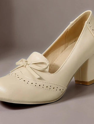 Adelaide closed-toe bow slip-on pumps on a low heel, shown in beige, pink and blue