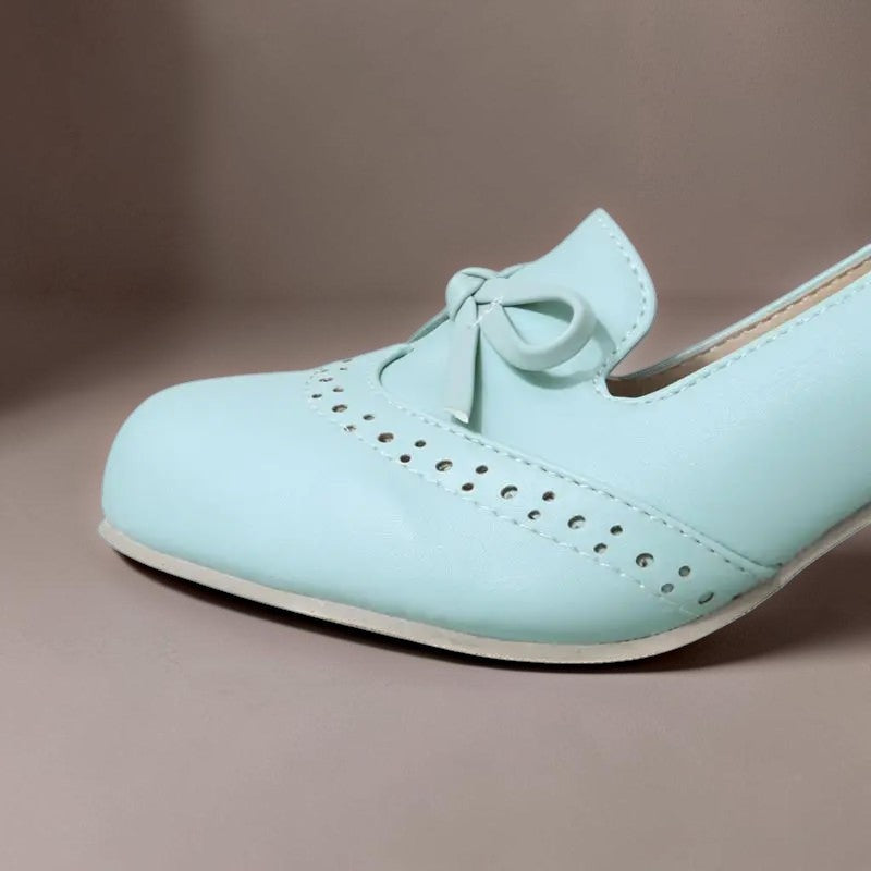 Adelaide closed-toe bow slip-on pumps on a low heel, shown in beige, pink and blue