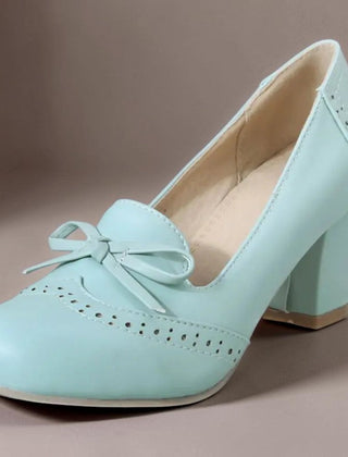 Adelaide closed-toe bow slip-on pumps on a low heel, shown in beige, pink and blue