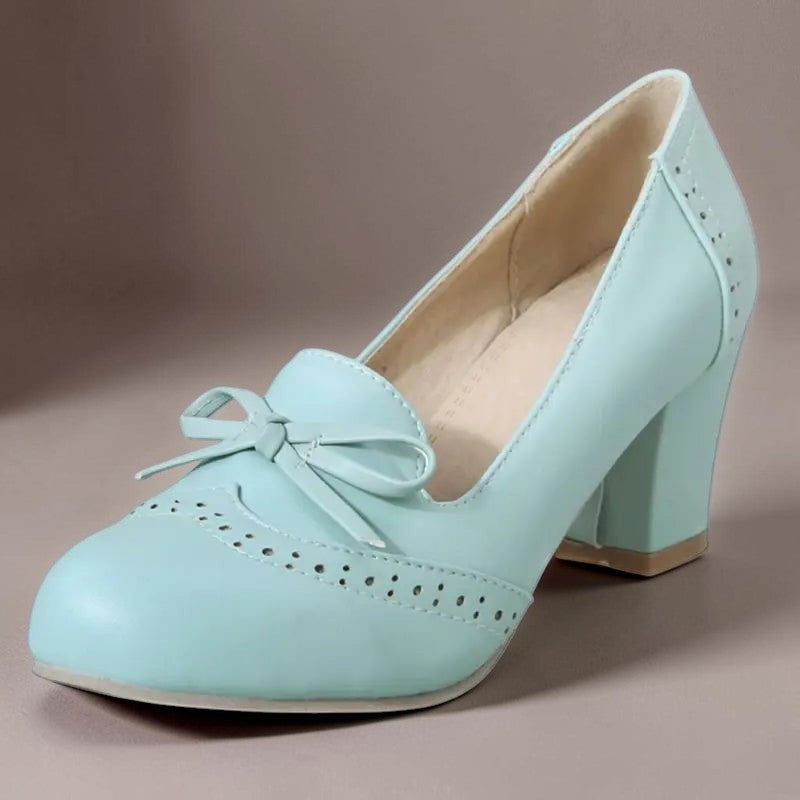 Adelaide closed-toe bow slip-on pumps on a low heel, shown in beige, pink and blue