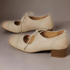 Constance carved leather lace-up Oxfords with a low block heel