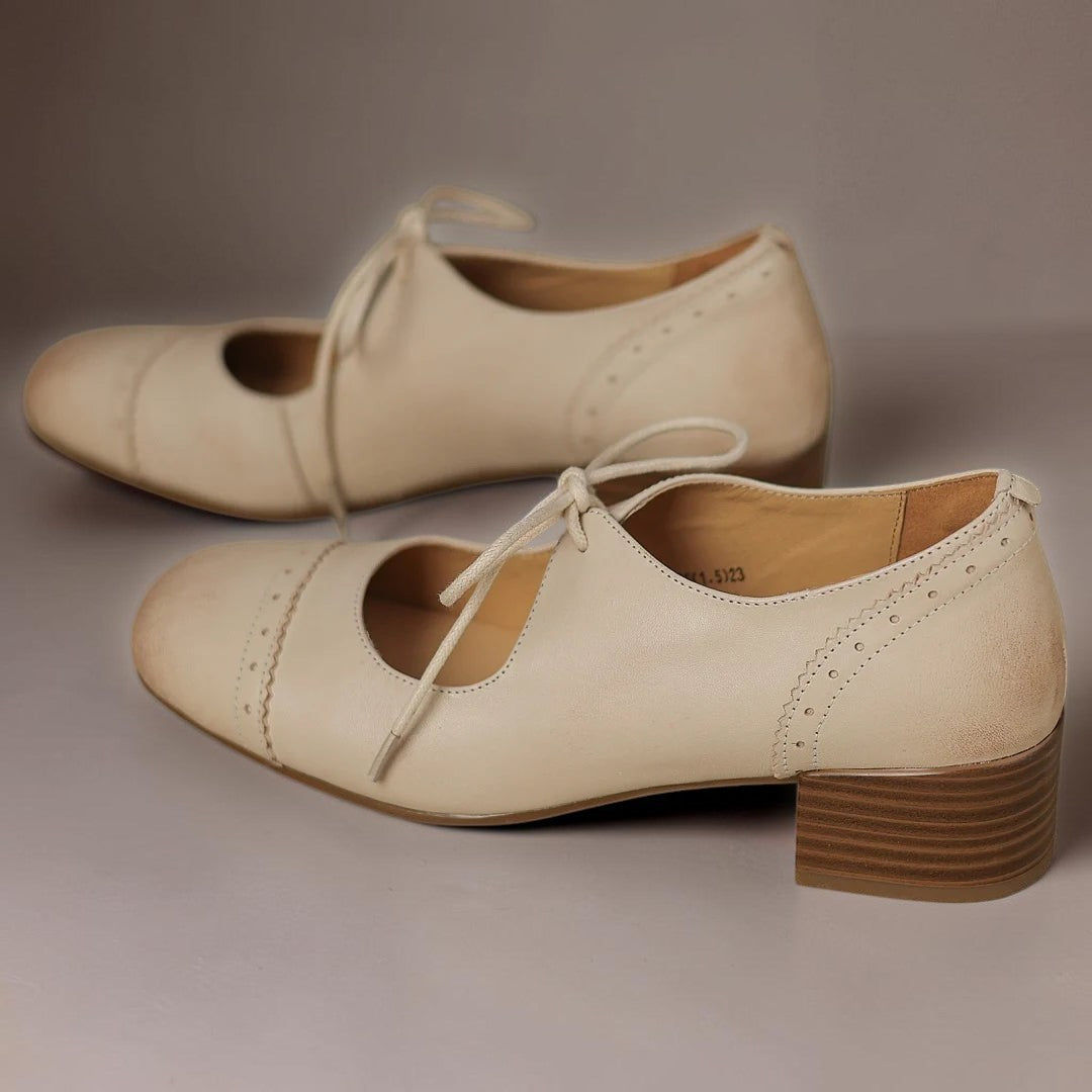 Constance carved leather lace-up Oxfords with a low block heel