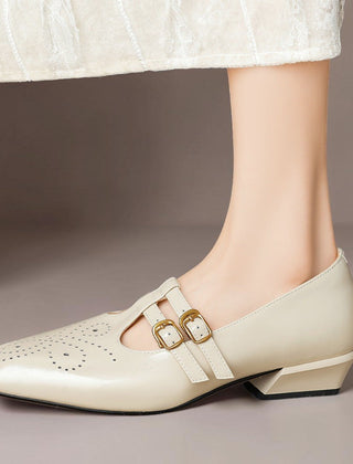 Brogued leather Mary Jane pump with dual buckled straps and a low block heel