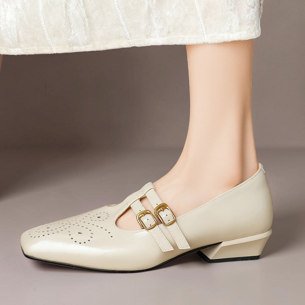 Brogued leather Mary Jane pump with dual buckled straps and a low block heel