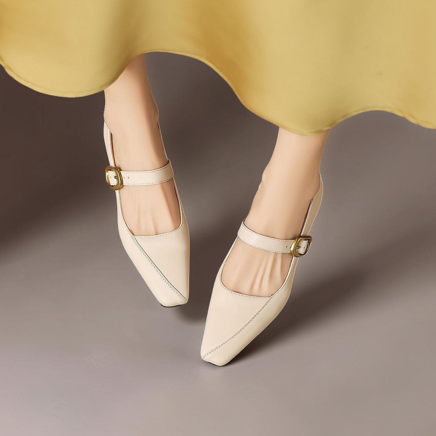 Paneled Mary Jane block heel with gold-tone instep buckle in beige and black