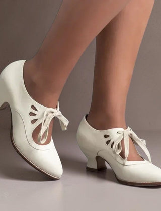Vintage lace-up Mary Jane pumps with adjustable instep strap and rounded toe