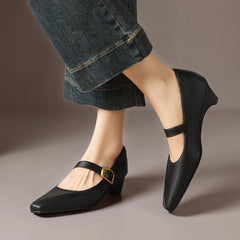 Paneled Mary Jane block heel with gold-tone instep buckle in beige and black