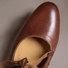 Leather bow Mary Jane flats with strap, shown in red, black and brown