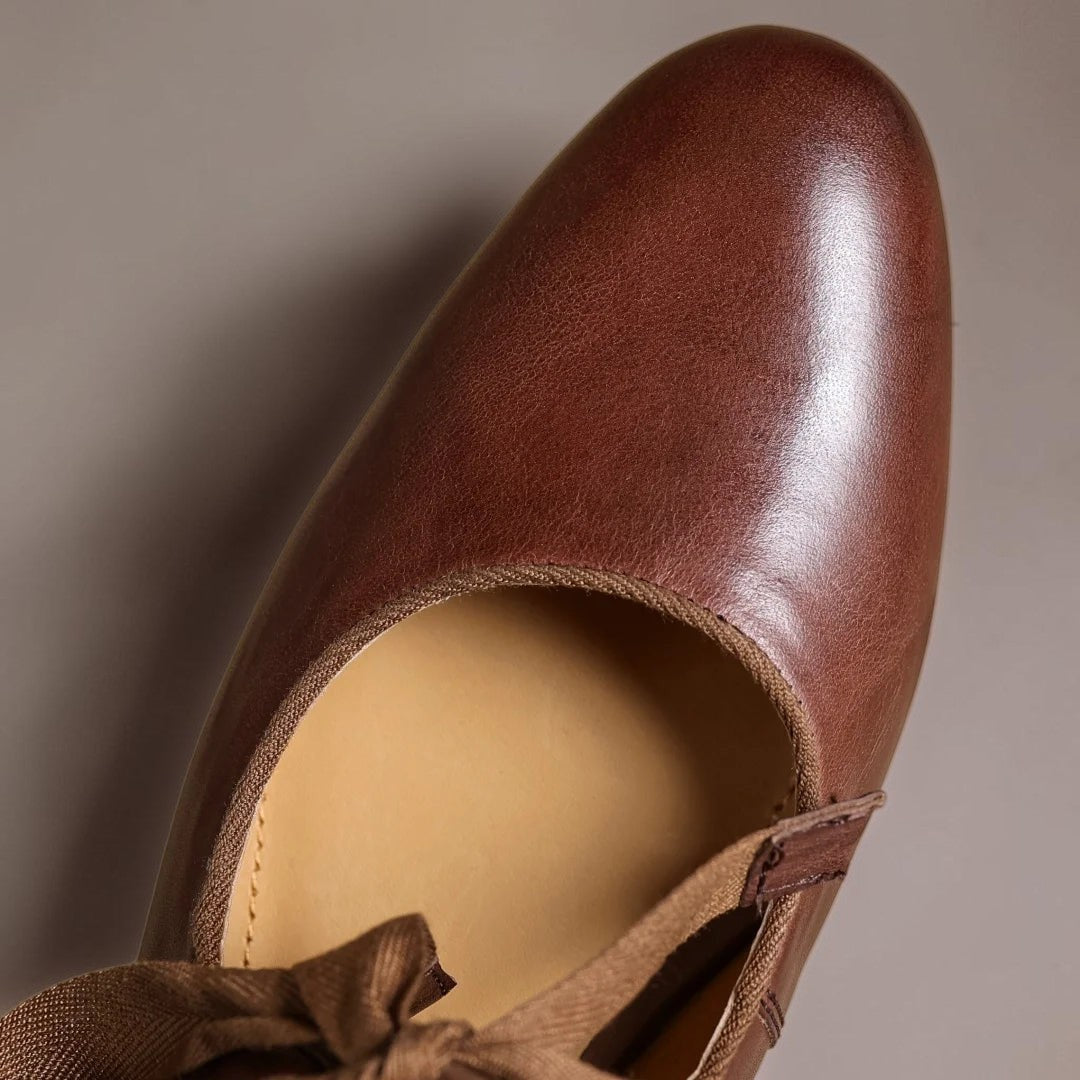 Leather bow Mary Jane flats with strap, shown in red, black and brown