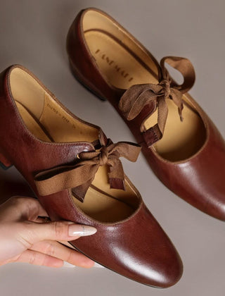 Leather bow Mary Jane flats with strap, shown in red, black and brown