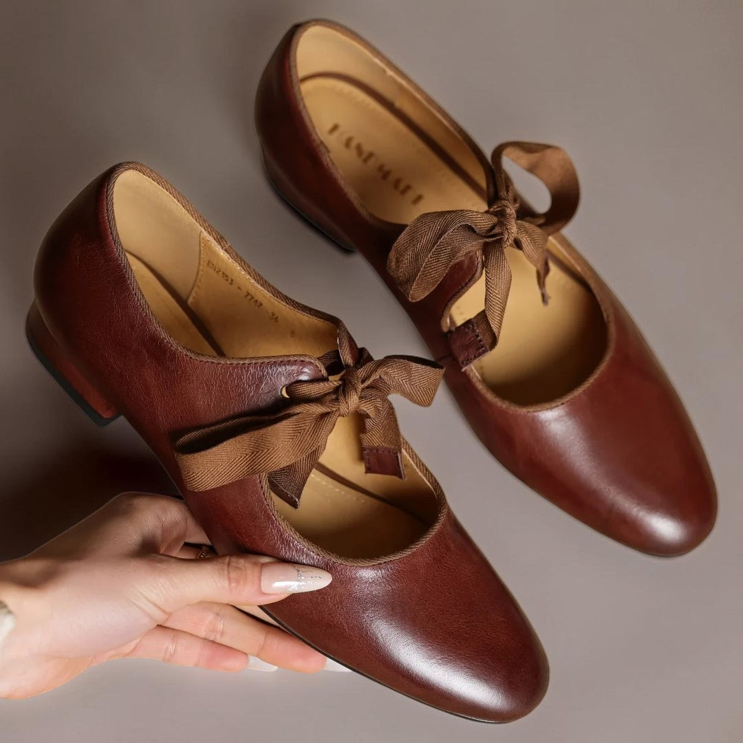 Leather bow Mary Jane flats with strap, shown in red, black and brown