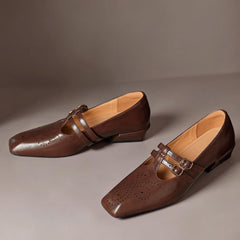 Brogued leather Mary Jane pump with dual buckled straps and a low block heel