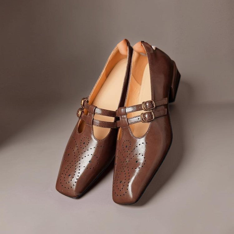 Brogued leather Mary Jane pump with dual buckled straps and a low block heel
