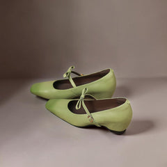 Bow-strap Mary Jane pump with concealed block heel and burnished leather, shown in green, pink and black