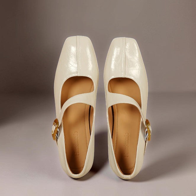Genuine leather Mary Jane heels with a tilted buckle strap, square toe and concealed wedge sole