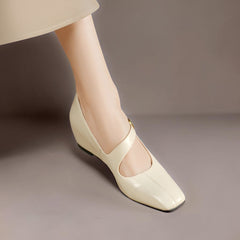Genuine leather Mary Jane heels with a tilted buckle strap, square toe and concealed wedge sole
