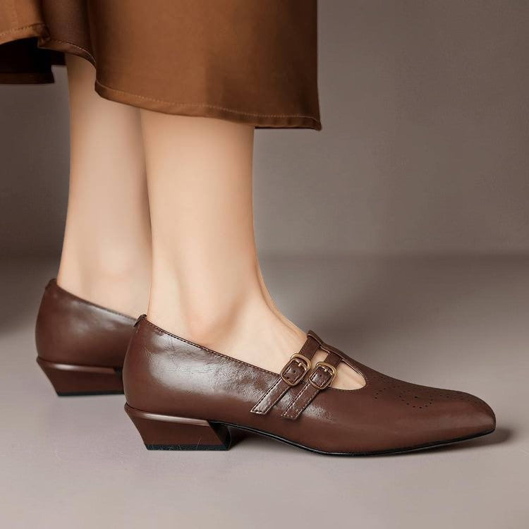 Brogued leather Mary Jane pump with dual buckled straps and a low block heel