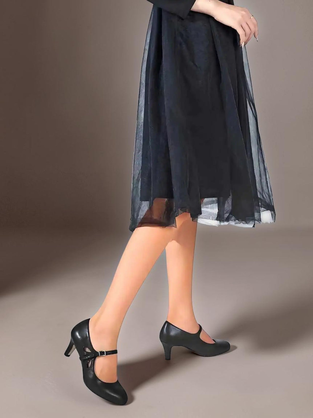 Classic black closed-toe office pumps on a manageable heel