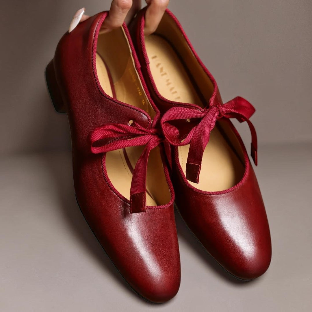 Leather bow Mary Jane flats with strap, shown in red, black and brown