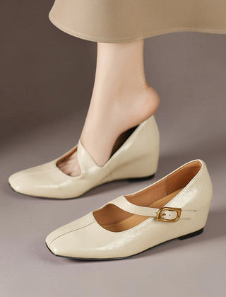 Genuine leather Mary Jane heels with a tilted buckle strap, square toe and concealed wedge sole