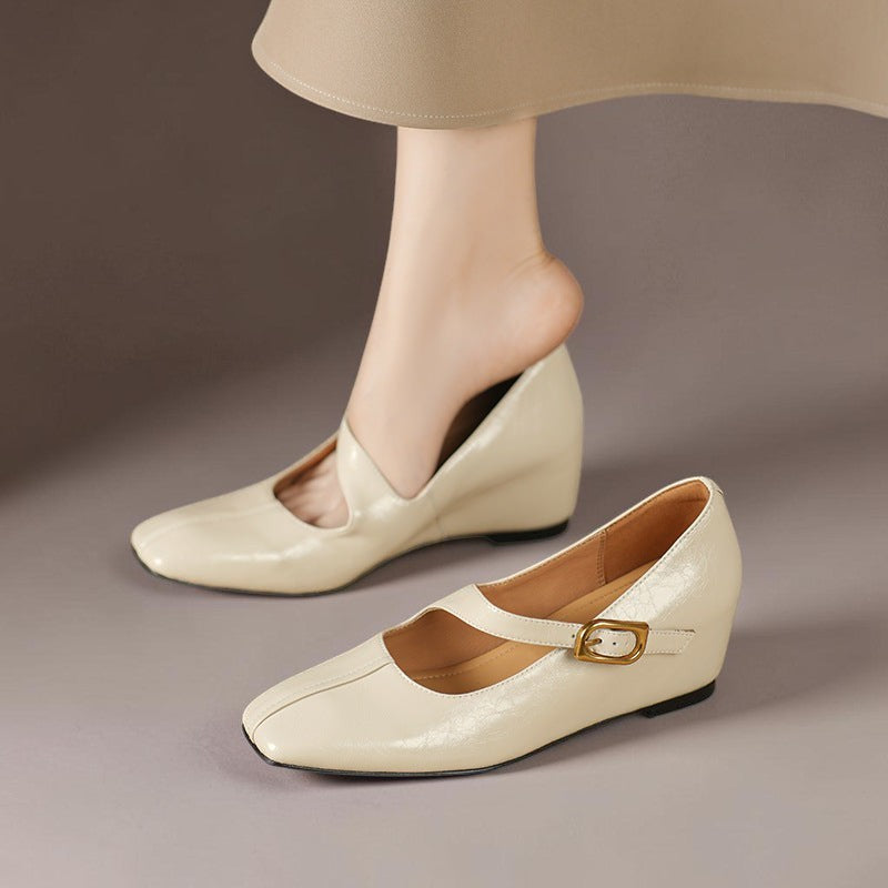Genuine leather Mary Jane heels with a tilted buckle strap, square toe and concealed wedge sole