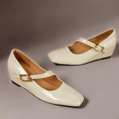 Genuine leather Mary Jane heels with a tilted buckle strap, square toe and concealed wedge sole