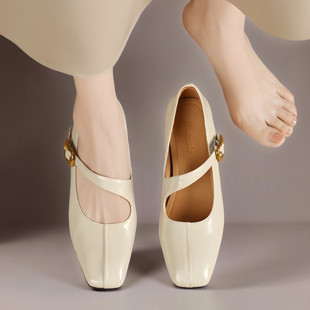 Genuine leather Mary Jane heels with a tilted buckle strap, square toe and concealed wedge sole