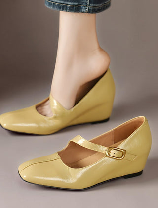 Genuine leather Mary Jane heels with a tilted buckle strap, square toe and concealed wedge sole